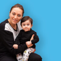 mum with toddler on knee