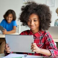 Teenager using a digital tablet