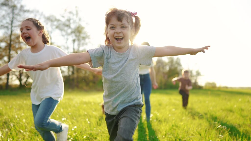 Group,Of,Children,Running,In,The,Park.,Happy,Family,Baby