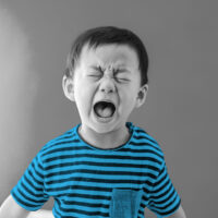 young boy screaming and crying