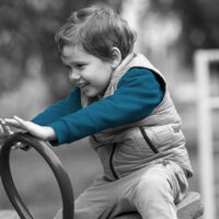 happy boy on see saw