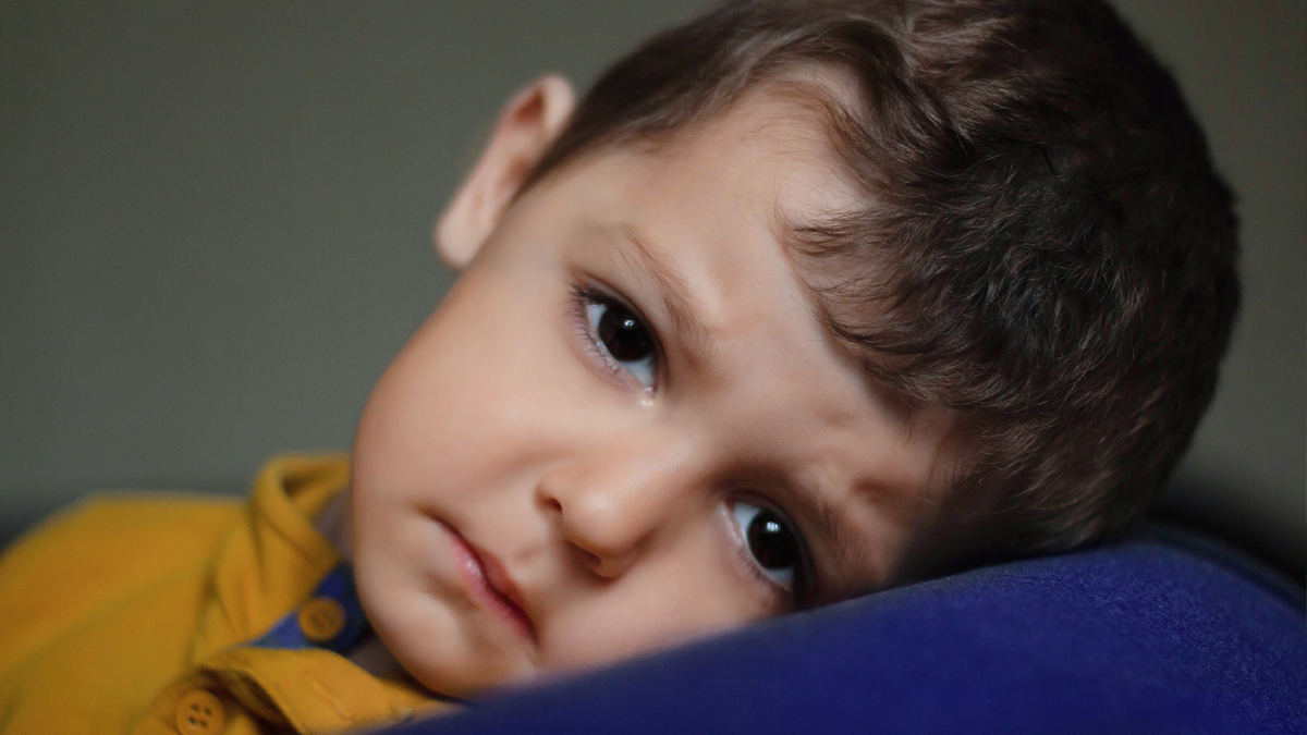 very sad boy. offended a child. close up portrait looking at the camera. feels lonely misses parents. freedom Ukraine