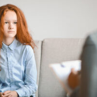 teen girl talking to psychologist