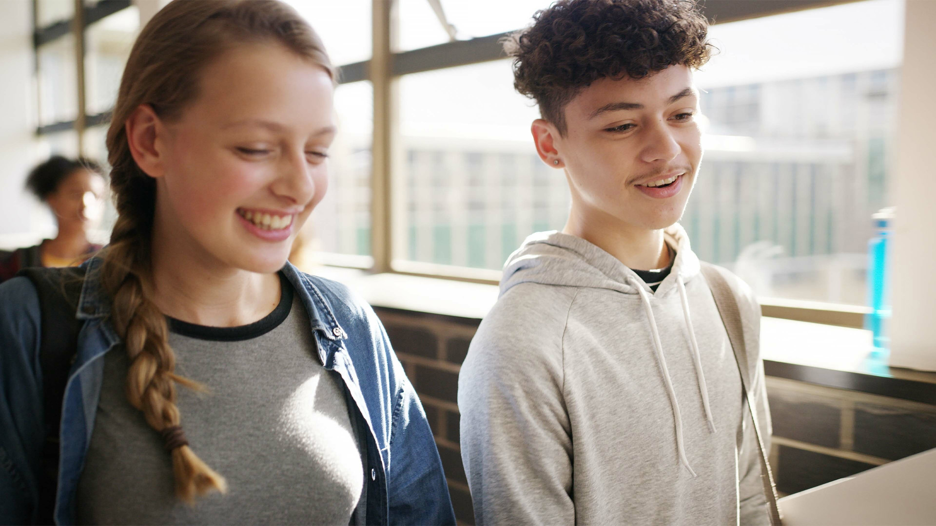 Boy, girl and laugh in hallway with books Boy, girl and laugh in hallway with books