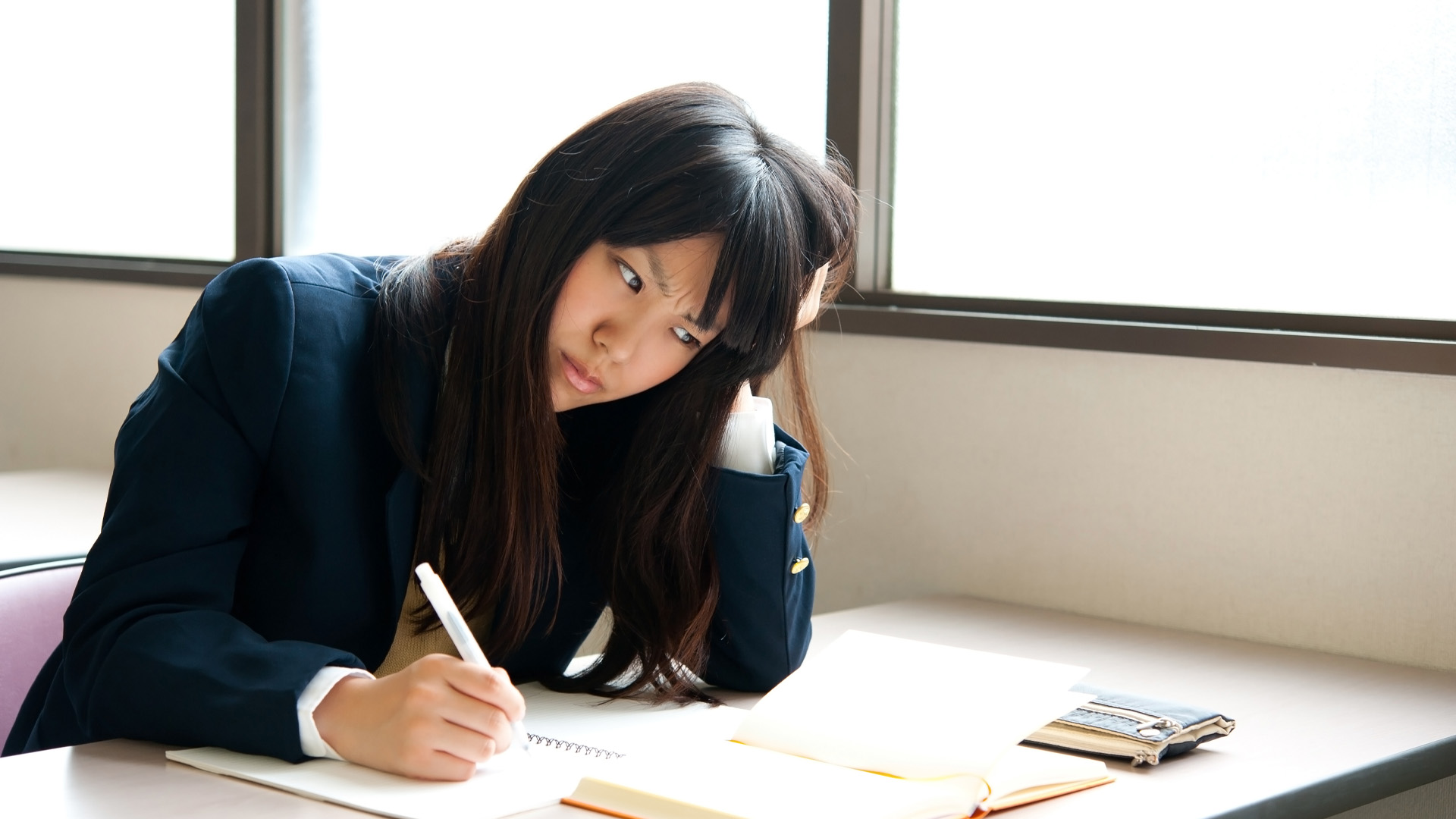 asian high schoolgirl studying in classroom asian high schoolgirl studying in classroom